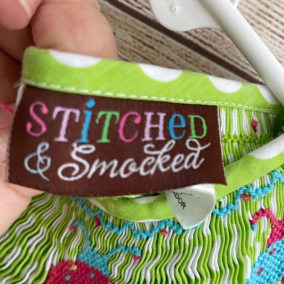 STITCHED AND SMOCKED GREEN AND WHITE POLKA DOT DRESS WITH EMBROIDERED LADYBUGS - Picture 8 of 9